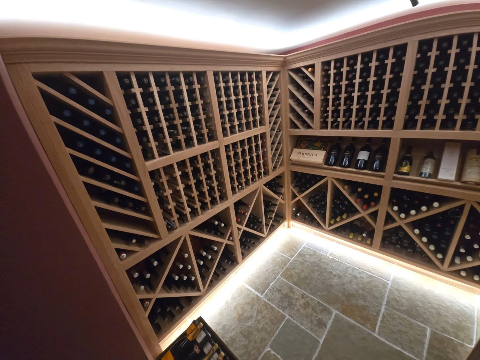 A wine cellar with many bottles of wine.